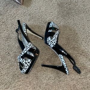 Black and white patent leather. Good Condition